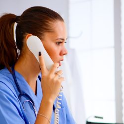 Specialist doctor nurse checking appointment during telehealth Specialist doctor nurse checking appointment during telehealth communication in hospital. Healthcare physician in medicine uniform, receptionist doctor assistant helping with phone concultation